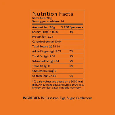 Kaju Anjeer Burfi with figs and cashew nuts displayed on a wooden table