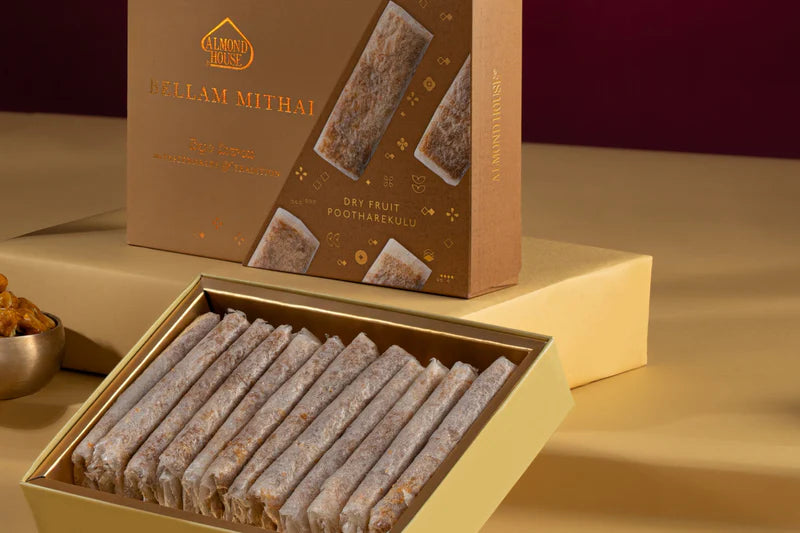 Box of Almond House Bellam Dry Fruit Pootharekulu sweets neatly arranged in golden packaging