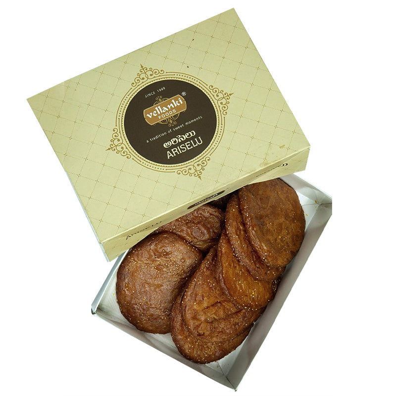 Enjoy Vellanki Foods' Ariselu (Ghee) – a traditional Andhra sweet made with rice flour, jaggery, and ghee. Order online for authentic festive flavors