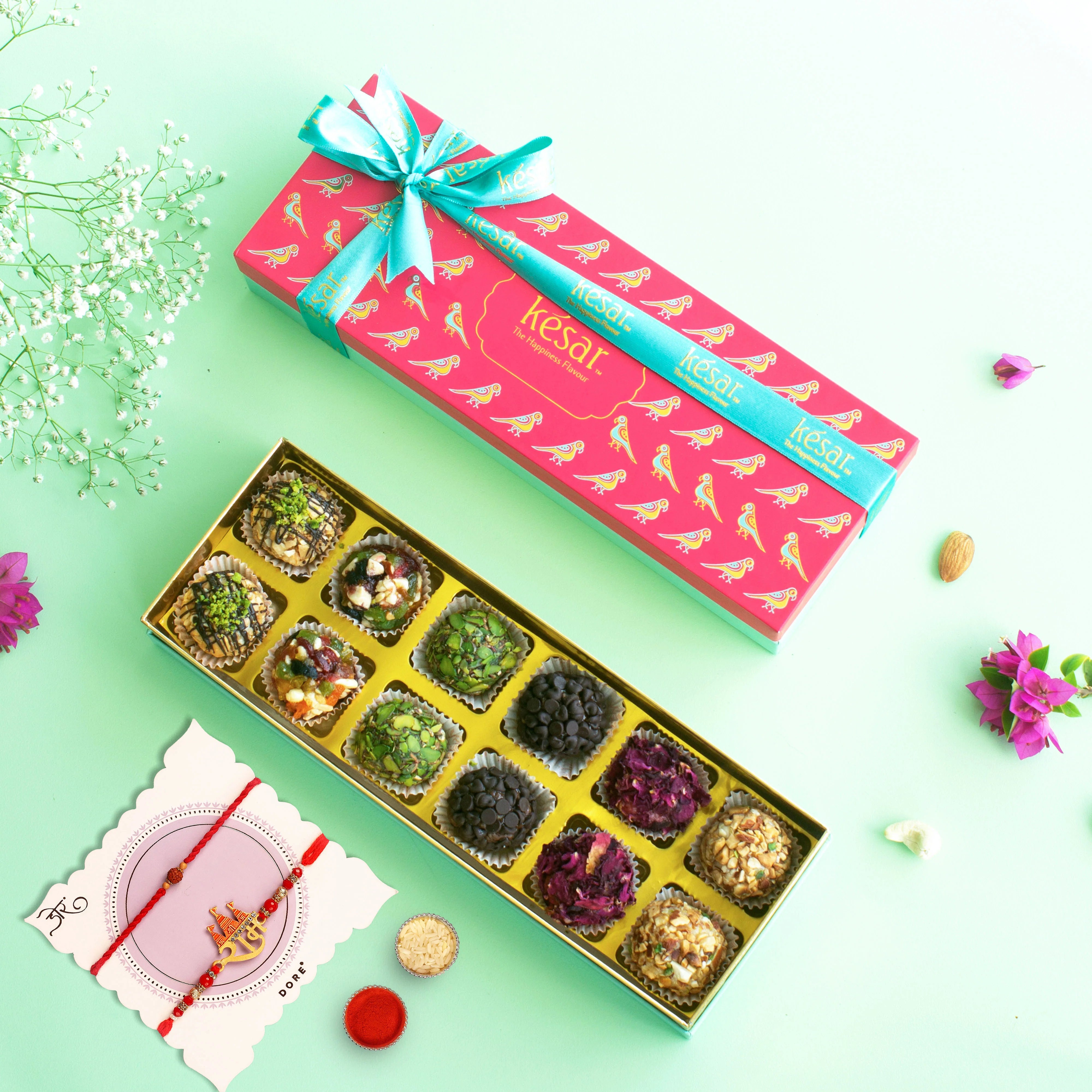 Kesar Sweets Artisanal Premium Assorted Laddoo 12 pcs in a Fancy Gift Box With 2 Rakhis