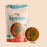Sambhar package with a bowl of sambar on a beige background