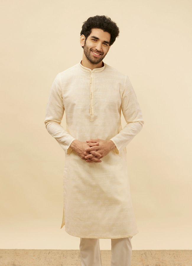 Manyawar Soft Cream Self Textured Kurta Set