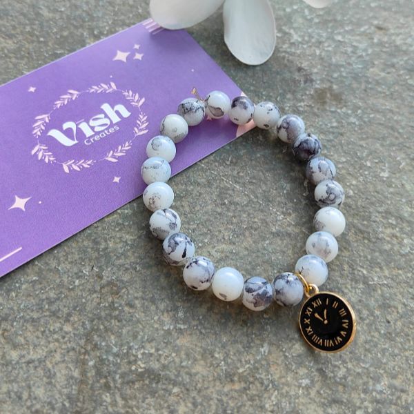 White beads bracelet with cute little charm