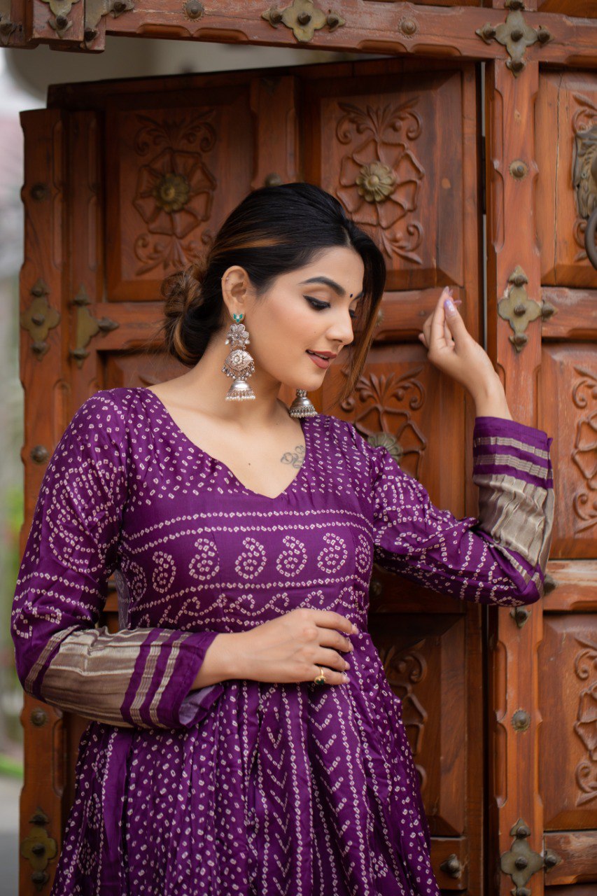 bandhej designer dresses The Bandhani Hand Print Dress is a beautiful and unique piece of clothing that features a colorful and intricate hand-printed design. The dress is made from high-quality fabric and is perfect for