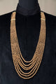 Tasva Seven Layered Gold Beaded Mala